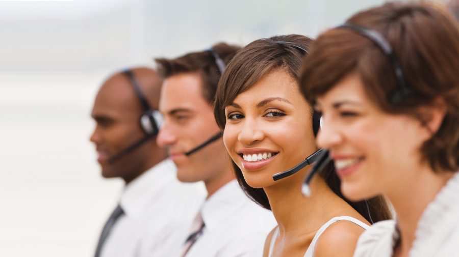 Happy call center employees with headset